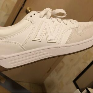 Size 11 women’s, Size 9.5 men new balance shoes